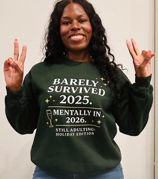 Woman wearing green sweatshirt that says Barely Survived 2025 Mentally in 2026